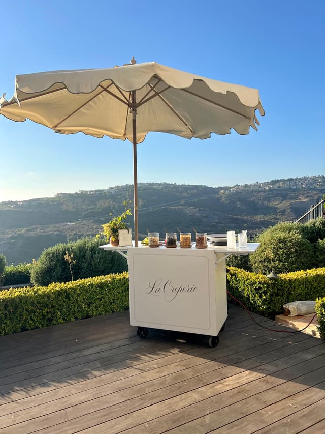 La Creperie cart on a hillside terrace at golden hour