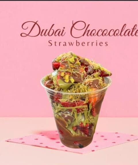 Dubai chocolate strawberries in a cup with pistachio