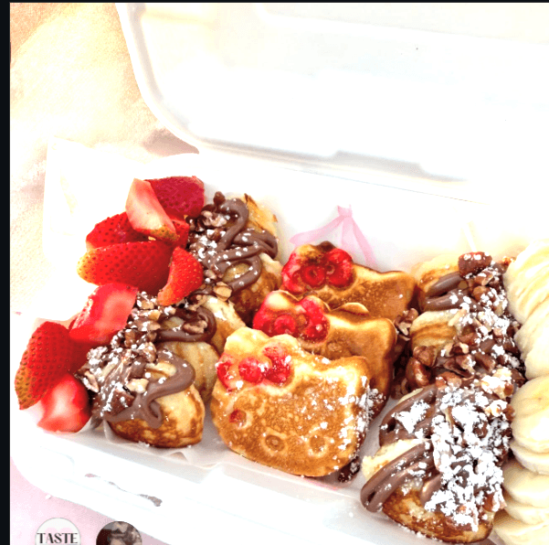 Hello Kitty mini pancakes dessert spread at a kids party